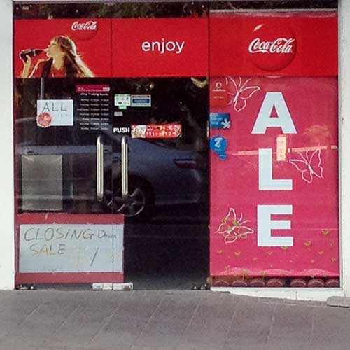 Angle Limited funny signage Coca-Cola shop front with Ale sign