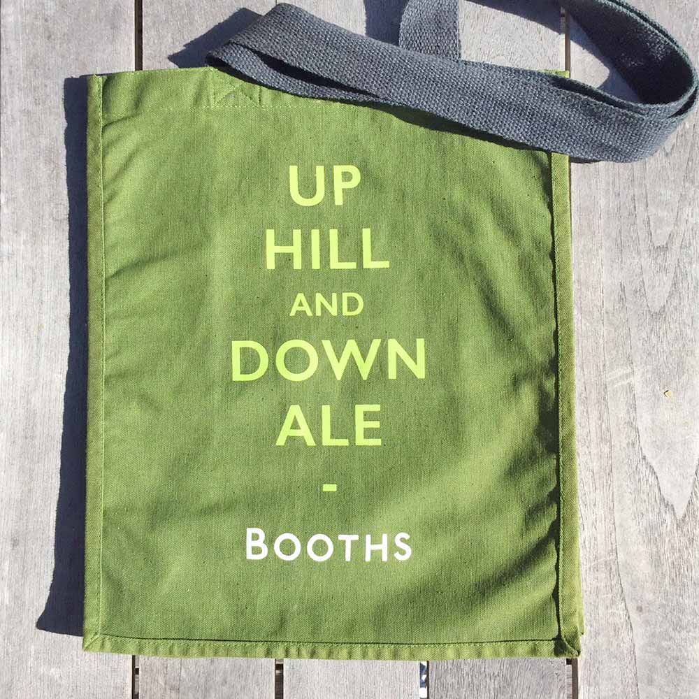 Booths shopping bag demonstrates design thinking + up hill and down ale
