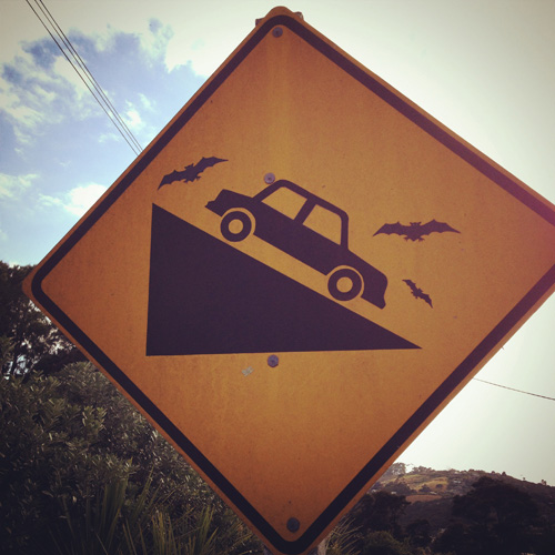 Creative steep gradient road sign on Waiheke Island, New Zealand